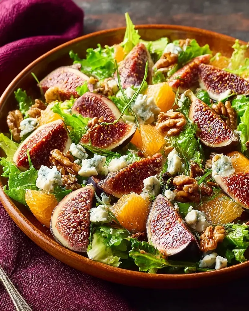 Orange, Fig, and Gorgonzola Salad 2 Fresh oranges, dried figs, and crumbled gorgonzola cheese displayed for salad preparation